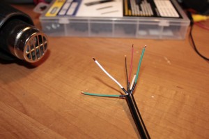 Heat Shrink tubing from Harbor Freight has been incredibly useful for more than a few of my recent projects.  I trust it to hold on more securely in the long-haul than regular electrical tape, and it looks more professional on a finished product, too.